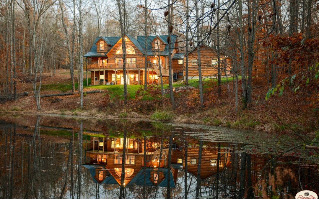 log home in the woods with lake